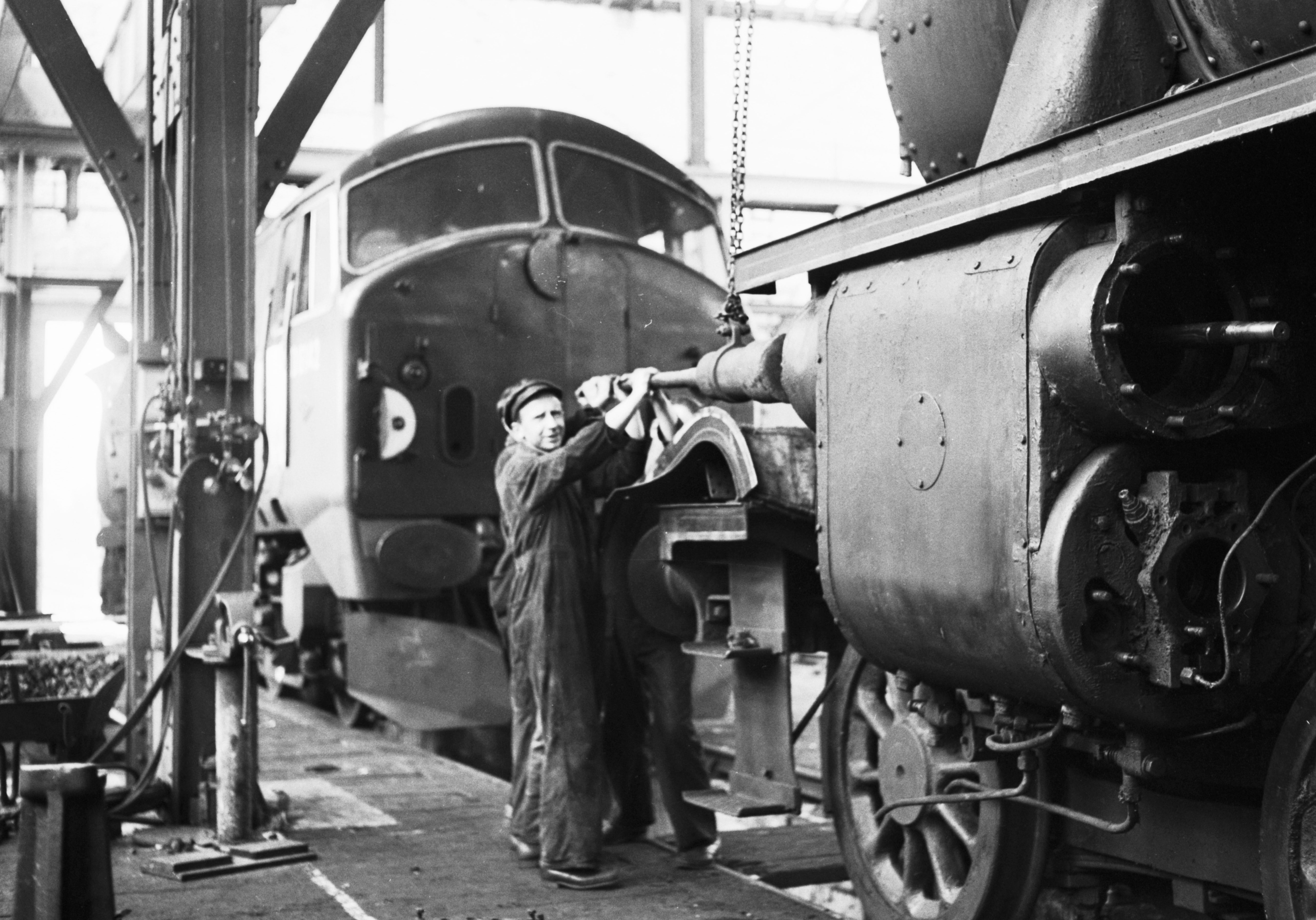 AN Inverurie Loco Works 1962-08-28_5 (C)AJL
Neg.No. G149
"Workmen at the Inverurie Loco Works working on the piston of a steam engine in 1962."