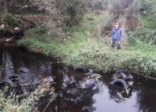 Hundreds of tyres have been found illegally flytipped into the Black Burn near Pluscarden Abbey last week.