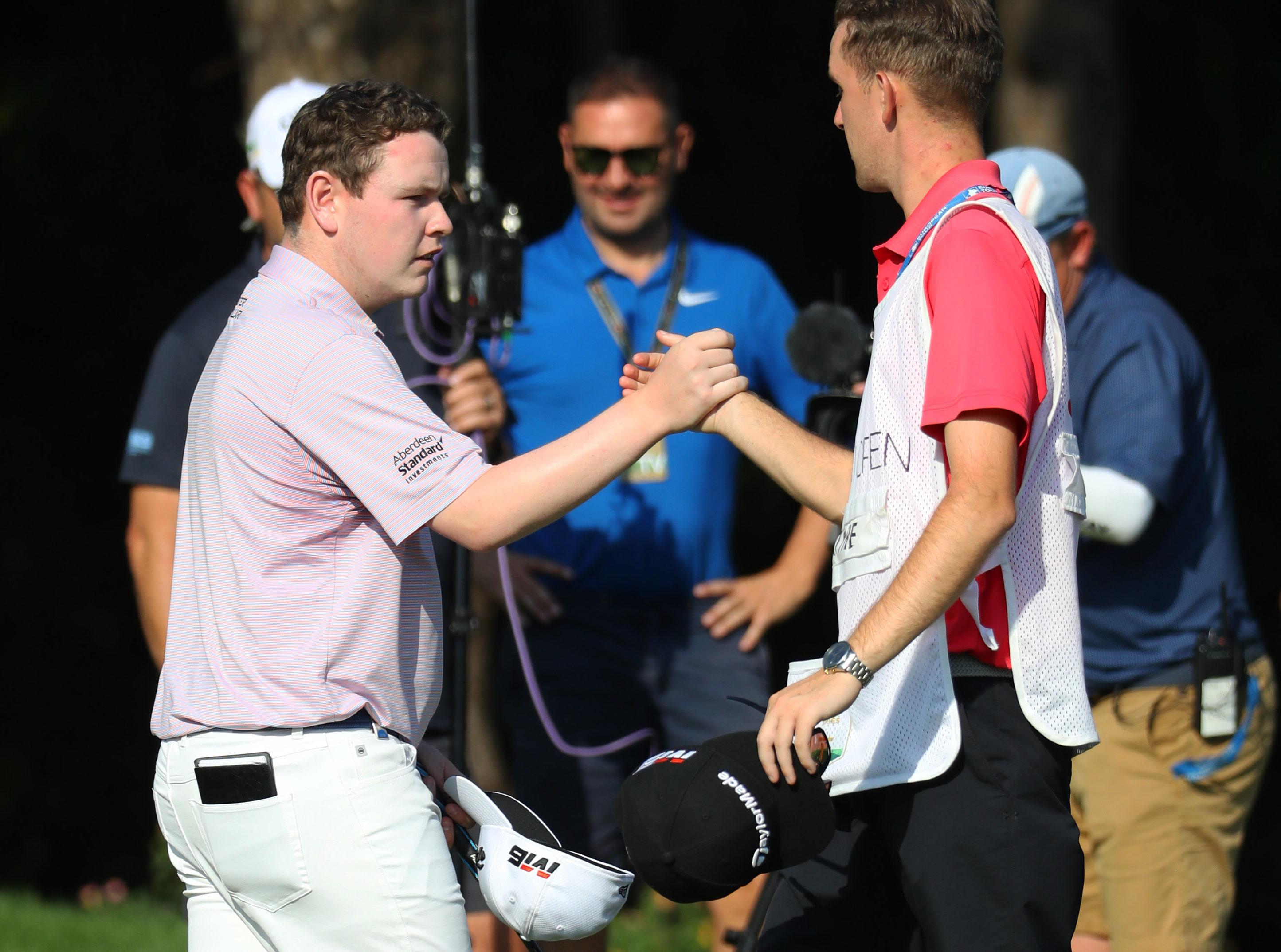 Robert MacIntyre of Scotland shakes hands with his caddie after playing his final shot on the ninth during Day Two of the Turkish Airlines Open at The Montgomerie Maxx Royal on November 08, 2019 in Belek, Turkey.