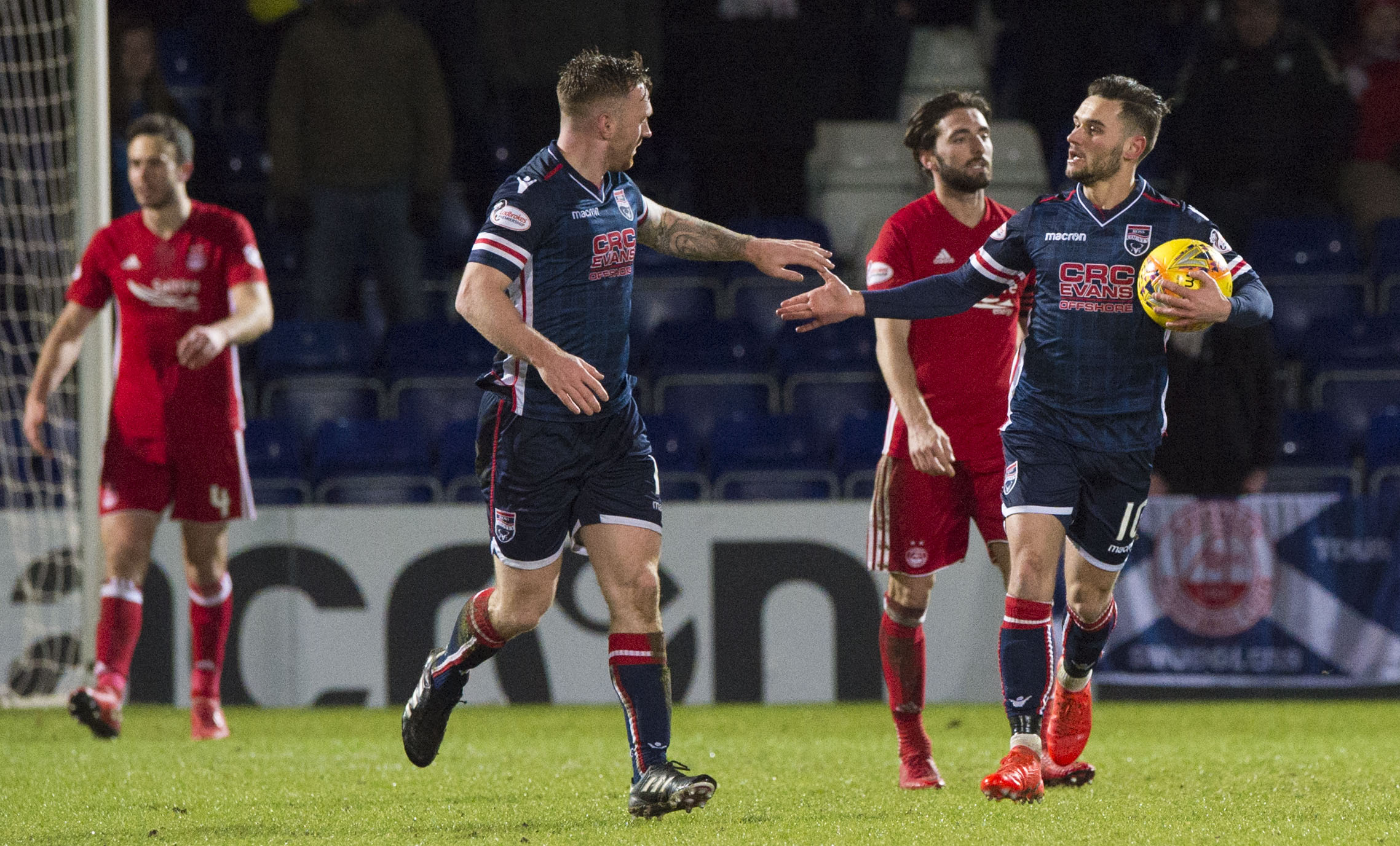 Ross County's Alex Schalk, right, celebrates pulling a goal back in January 2018 against Aberdeen.
