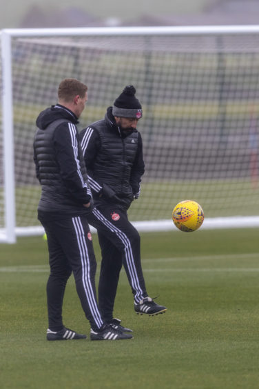 Derek McInnes keeps the ball up with coach Barry Robson.