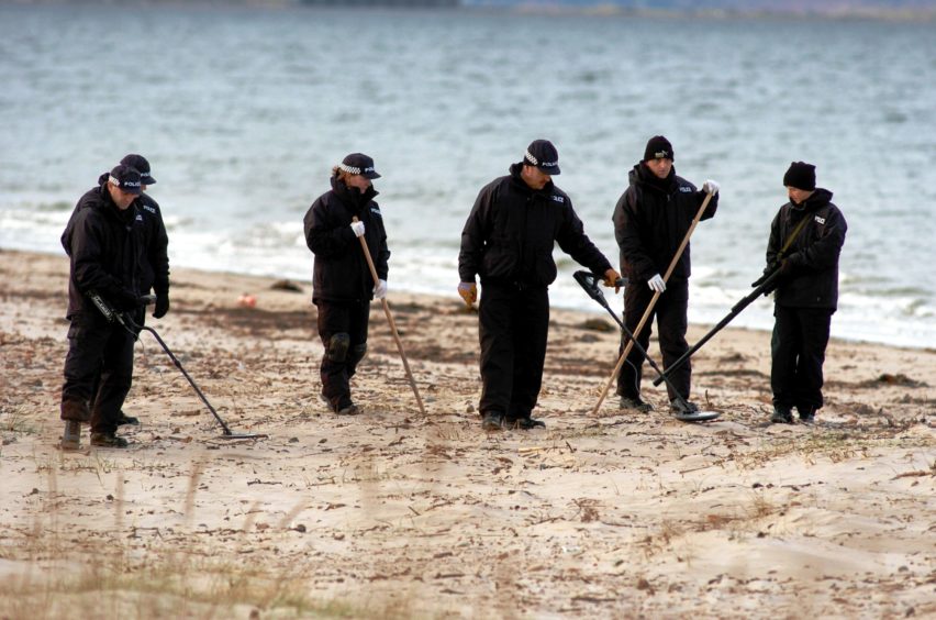 Police officers combing Nairn beach for evidence in an attempt to put there finger on a Alistair Wilson murder suspect