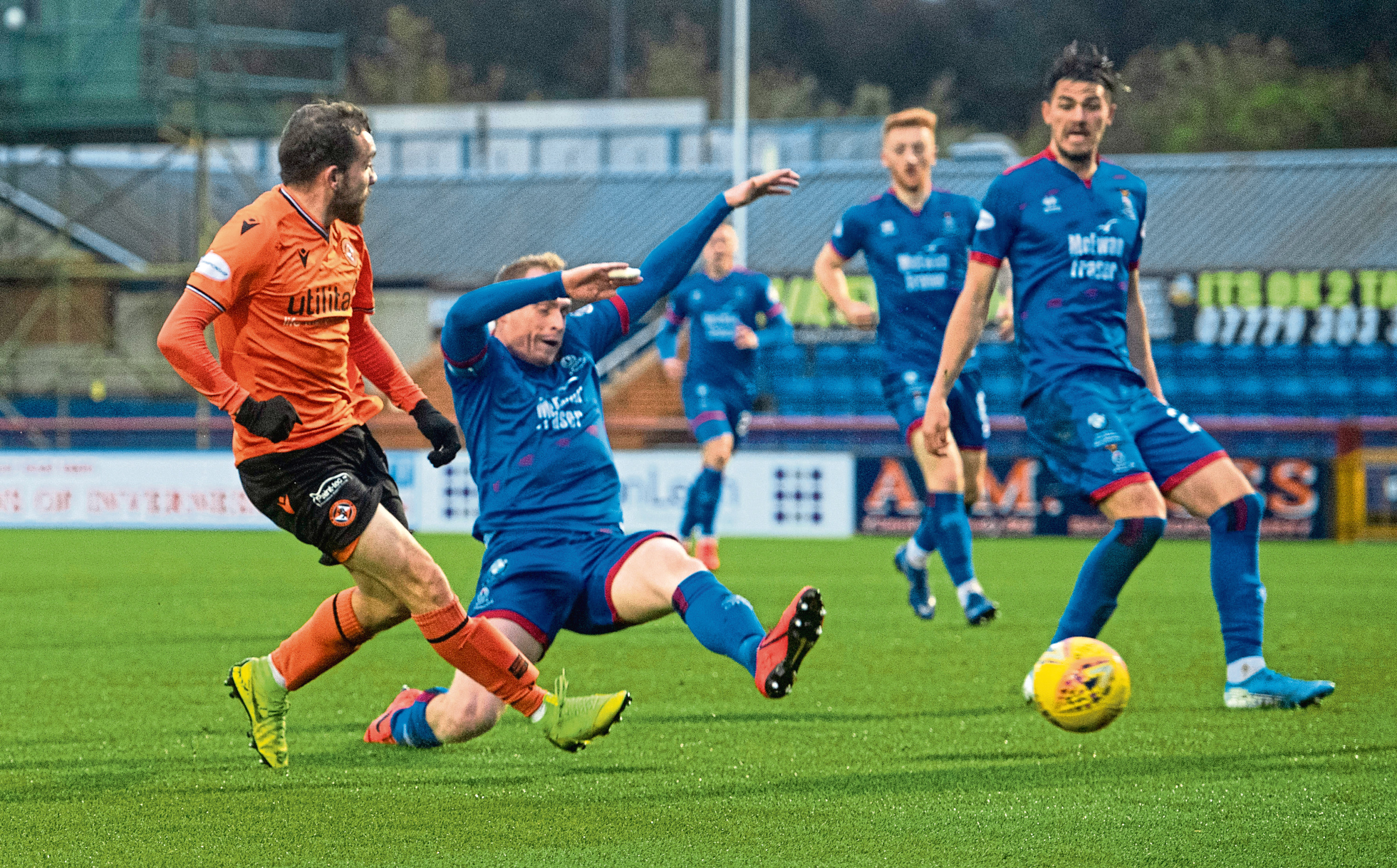 Dundee Utd's Paul McMullan's shot is deflected into the goal off Inverness' Shaun Rooney to make it 1-0 during the Ladbrokes Championship match between Inverness CT and Dundee United
