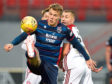 Ross County's Lee Erwin, left, competes with Scott Martin during the Ladbrokes Premiership match between Hamilton and Ross County.