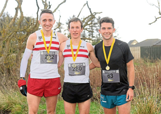Peterhead 10km top three. Left to right, 2nd Myles Edwards, 
1st James Hoad and 3rd Richard Strachan.  
Picture by Kath Flannery