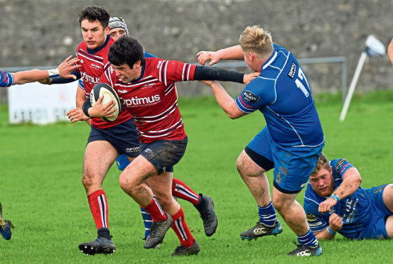 Sam Knudson running with the ball for Grammar.
Picture by Kenny Elrick