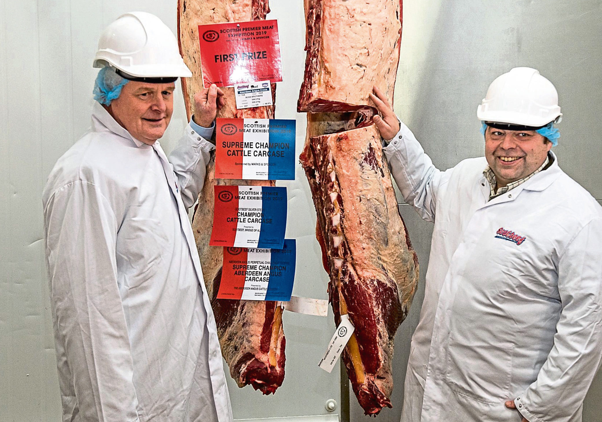 Gavin Ross, right, with judge Alan McNaughton and the overall carcase winner