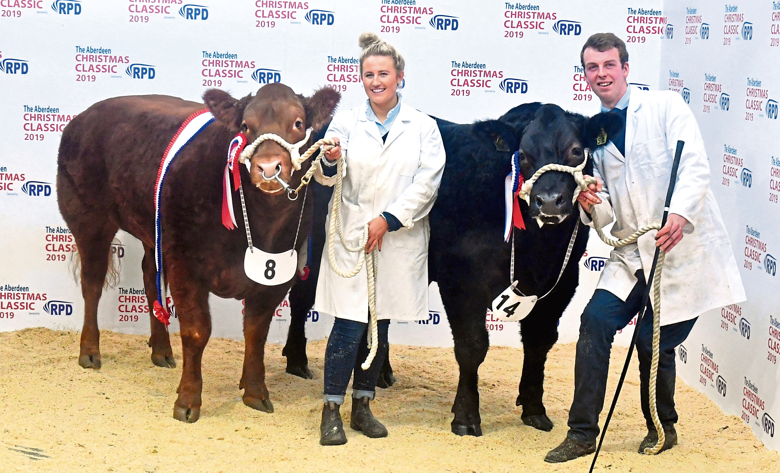 Rebecca Stuart with the overall champion, Cinnamon, and William Moir with the reserve champion, Gazza.