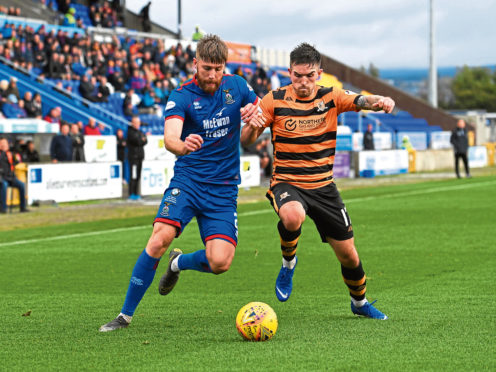 Shaun Rooney in action, left, against Alloa.