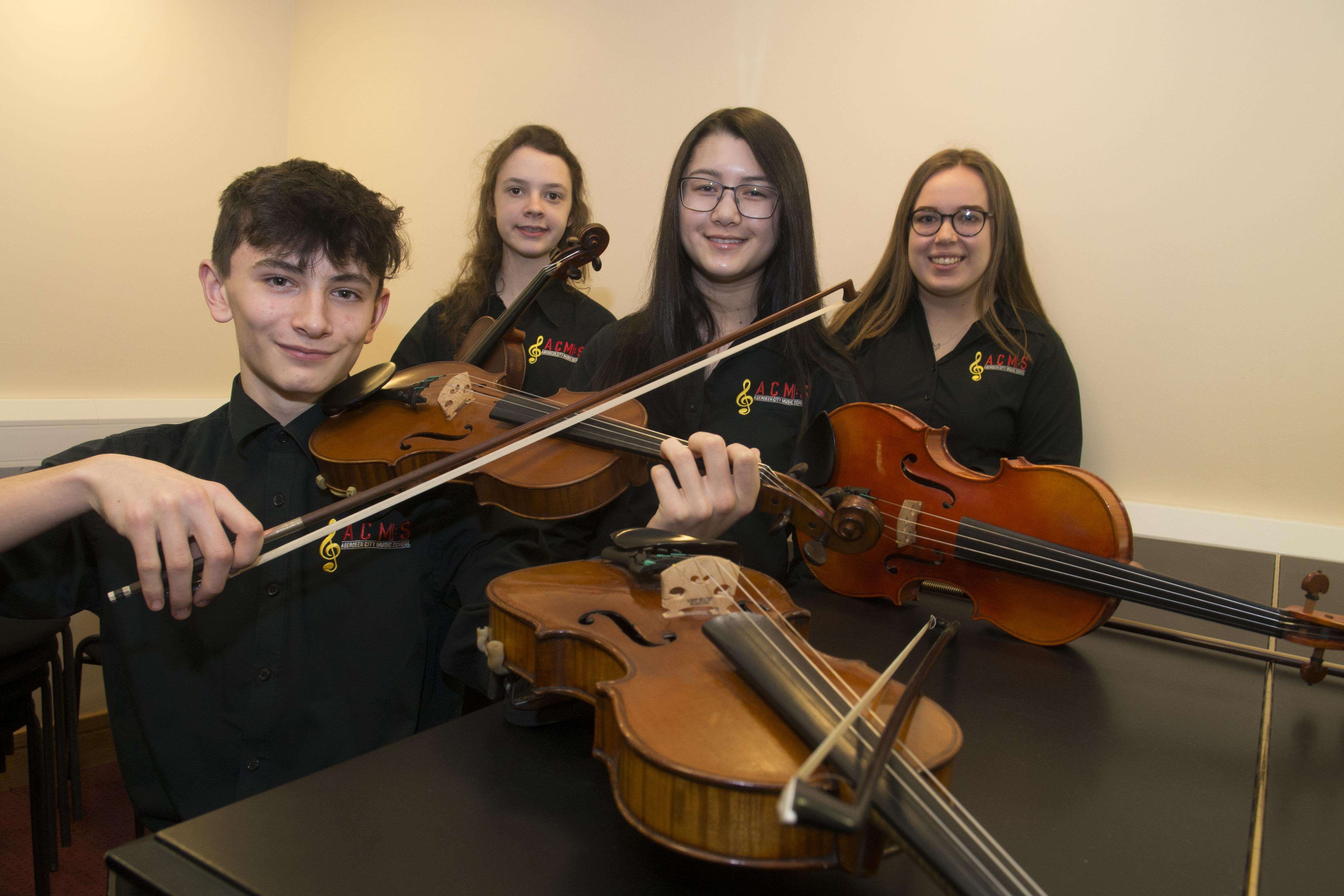 28/11/19 

L-R William Hodi,Charlotte Slater ,Sienna Lee and Ariana Black, 

Four pupils at Aberdeen City Music School are to play at the prestigious BBC Sports Personality of the Year event dinner next month.The awards, which have been a much-loved landmark in the UK’s sporting calendar since 1954 are making their Aberdeen debut at the new P&J Live venue on Sunday 15 December.The school’s talented string ensemble, comprising students Ariana Black, William Hodi, Charlotte Slater and Sienna Lee, will entertain the corporate audience before they head into the main show with a 30-minute programme performed during the award’s pre-dinner.