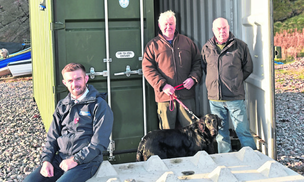 Kenny Brandie, Fishermen's Mission superintendent (front) with Fishermen Bill Westland (with Maisie, dog) and Jim Adam.
Picture by Colin Rennie.