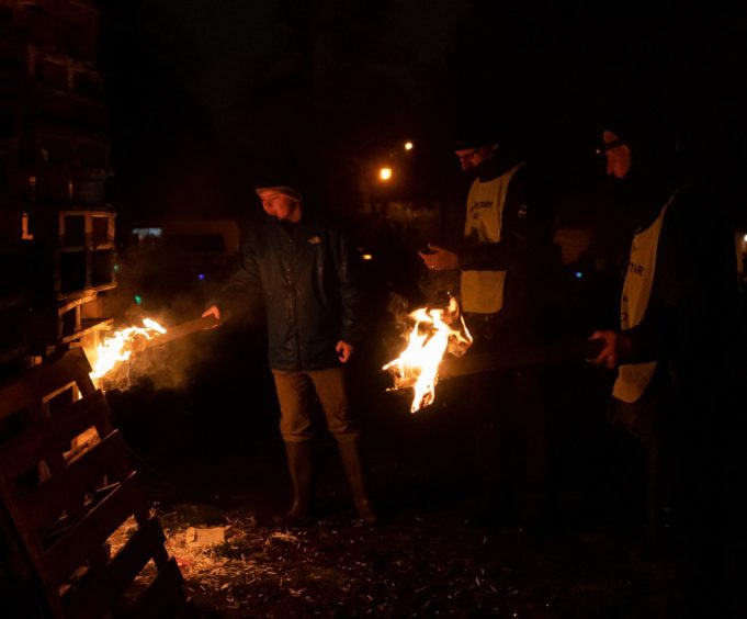 Aidan Henderson, Moray Young Citizen 2019 lights the bonfire at the Elgin Rotary Fireworks Display.