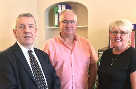 Highlands and Islands MSP David Stewart, pictured left, with Graham and Diane Matheson.