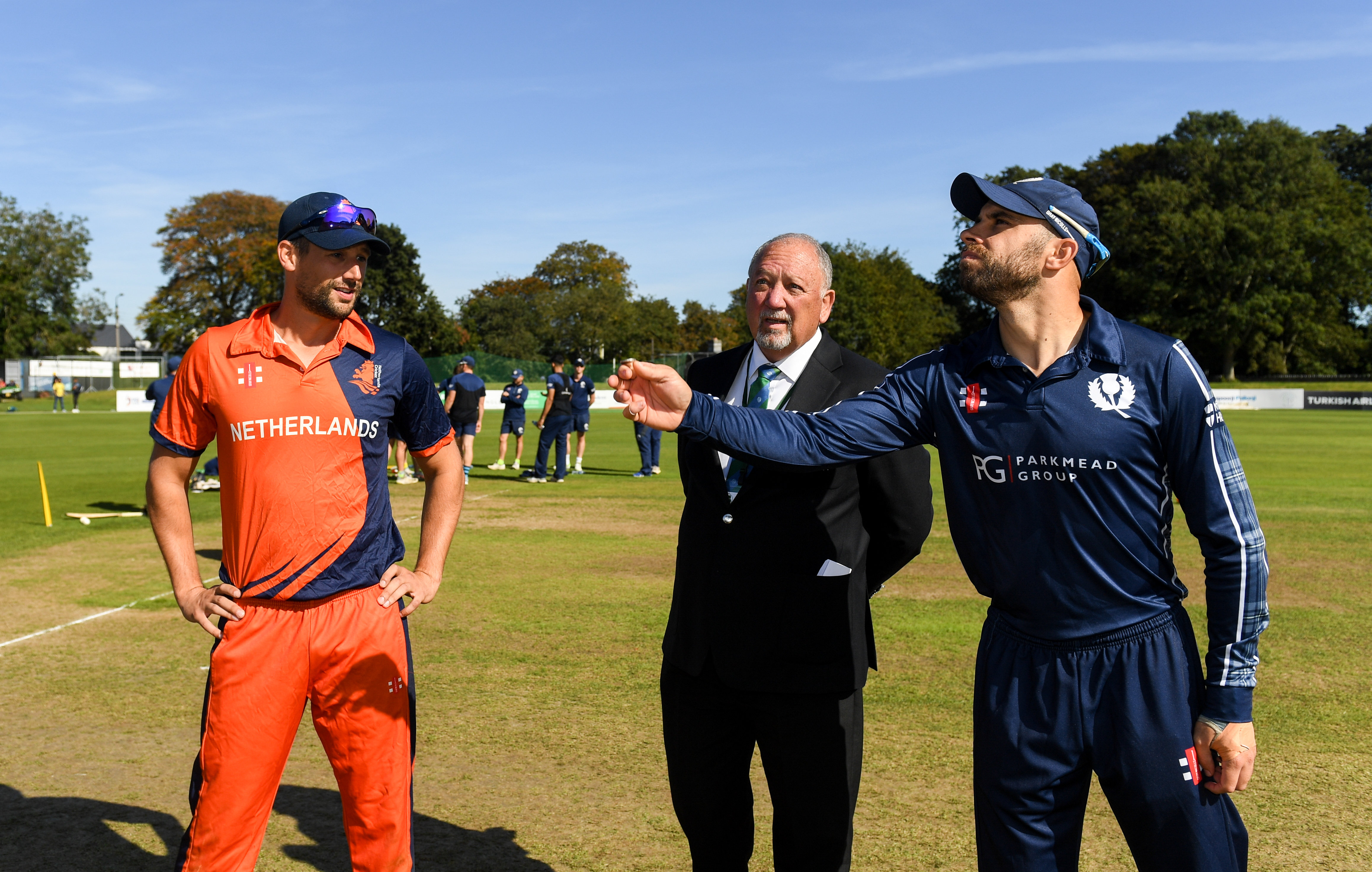 Kyle Coetzer of Scotland tosses the coin with Pieter Seelaar of Netherlands prior to the T20 International Tri Series match between Scotland and the Netherlands.