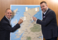 Chris Taylor, VisitScotland Regional Leadership Director and Jóhannes Þór Skúlason, of the Icelandic Travel Industry Association, who was the keynote speaker at the Highland Tourism Conference, are pictured with a map of the Highlands onto which delegates were encouraged to share and pin their hidden gems, with the idea of distributing visitors to new locations right cross the Highlands which they might not have thought of visiting.
