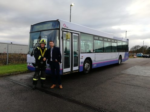 Michael Smith from First Bus with Gary McArthur, SFRS Station Commander at Portlethen Training Centre