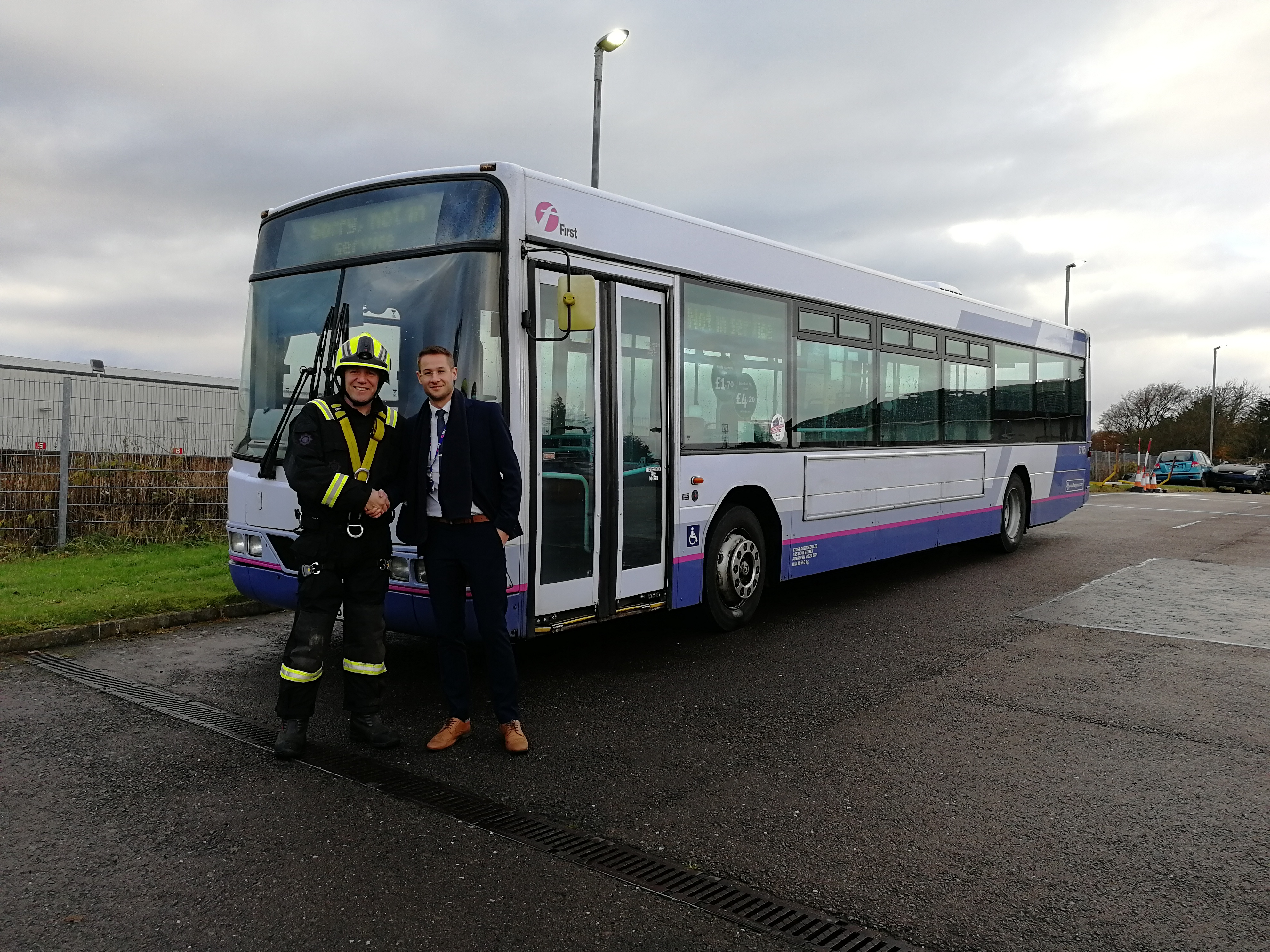 Michael Smith from First Bus with Gary McArthur, SFRS Station Commander at Portlethen Training Centre