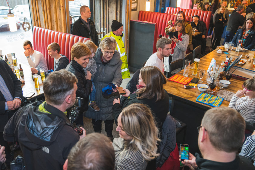 Nicola Sturgeon in BrewDog Dog Tap, Ellon, with patrons. Picture by Jamie Ross.