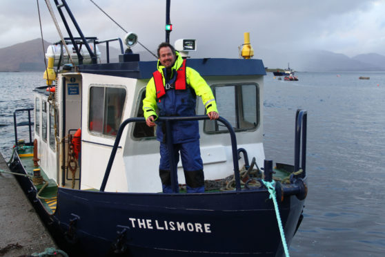 Alan MacKellar on the Lismore ferry at the jetty in Port Appin