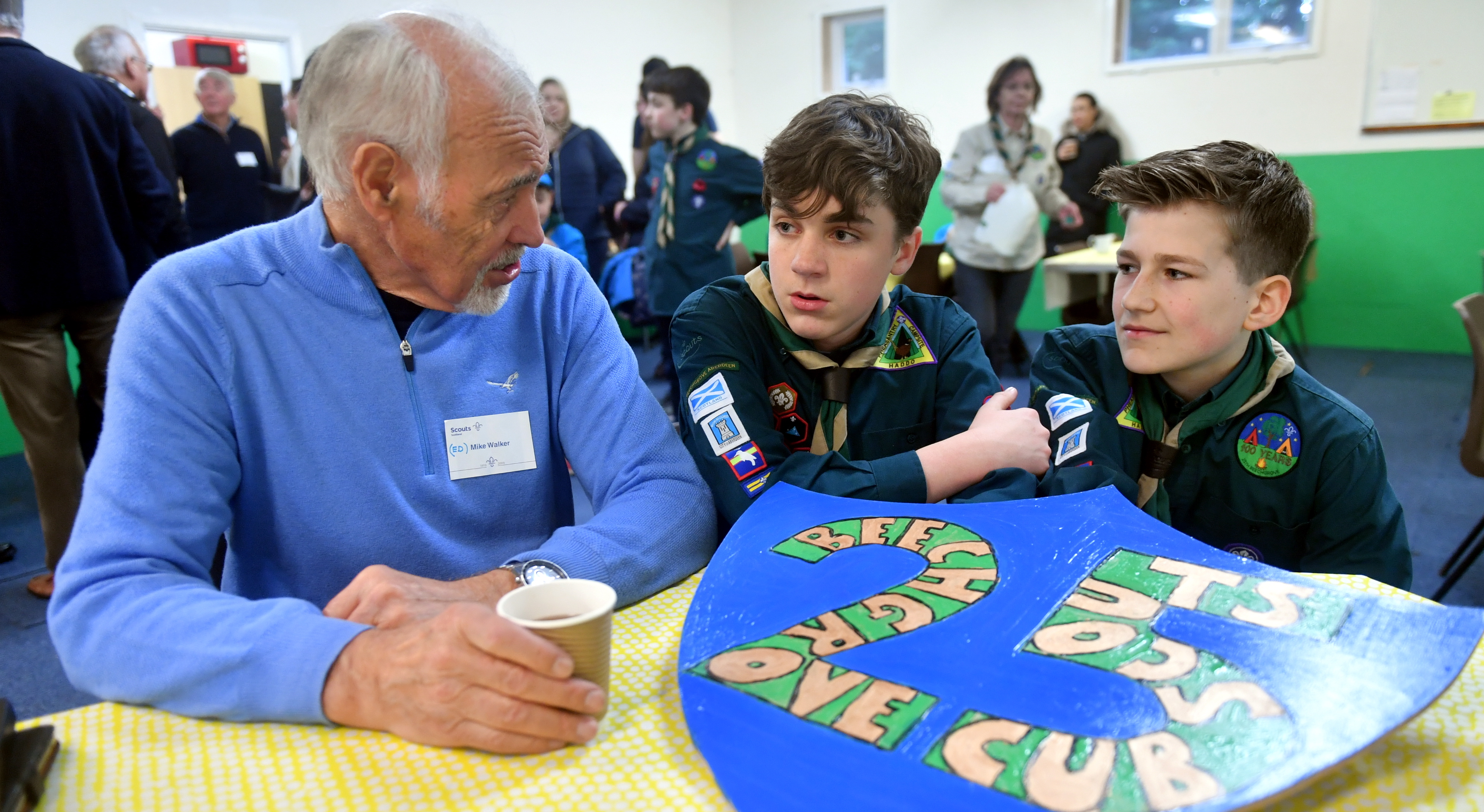 Mike Walker, who was in the 25th Aberdeen Scouts in 1954, talks to youngsters Nathan Senff and Luke Miller. Picture by Chris Sumner