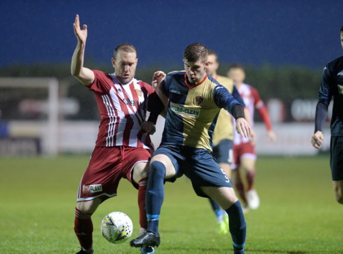 Formartine's Garry Wood and East Kilbride's Sam Fisher. 

Picture by KATH FLANNERY