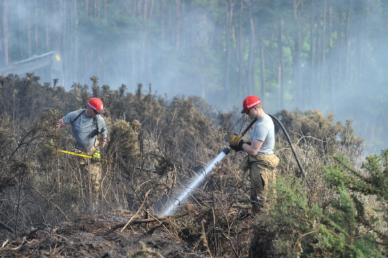 Firefighters tackle a gorse blaze near Hopeman in July 2018. Picture by Jason Hedges.