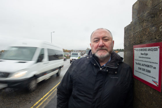 Elgin City South councillor John Divers on the New Elgin Road railway bridge. Picture by Jason Hedges.