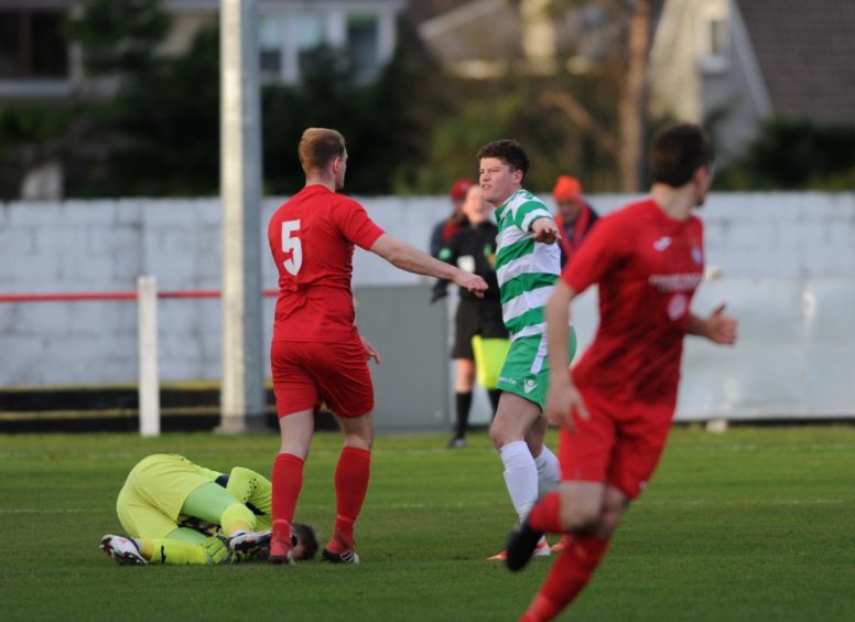 Tempers fly between Broras Mark Nicholson and Buckie's Sam Robertson resulting in a booking for Buckie

Picture by JASON HEDGES