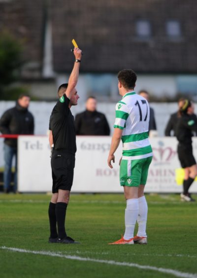 Tempers fly between Brora Mark Nicholson and Buckie's Sam Robertson resulting in a booking for Buckie

Picture by JASON HEDGES