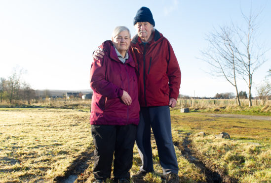 Des and Mike Budd at the Tomintoul field of hope. Picture by Jason Hedges.