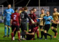 Inverurie Locos Andy Hunter falling to the ground after an altercation with Aberdeen's Ash Taylor.
Picture by Kenny Elrick