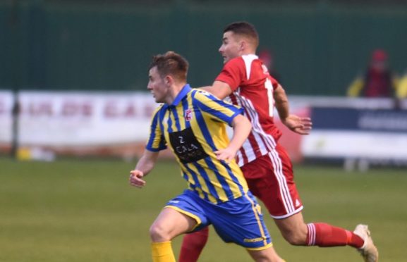 Scott Lisle on the attack for Formantine takes on Inverurie's Calum Dingwall
Picture by Paul Glendell