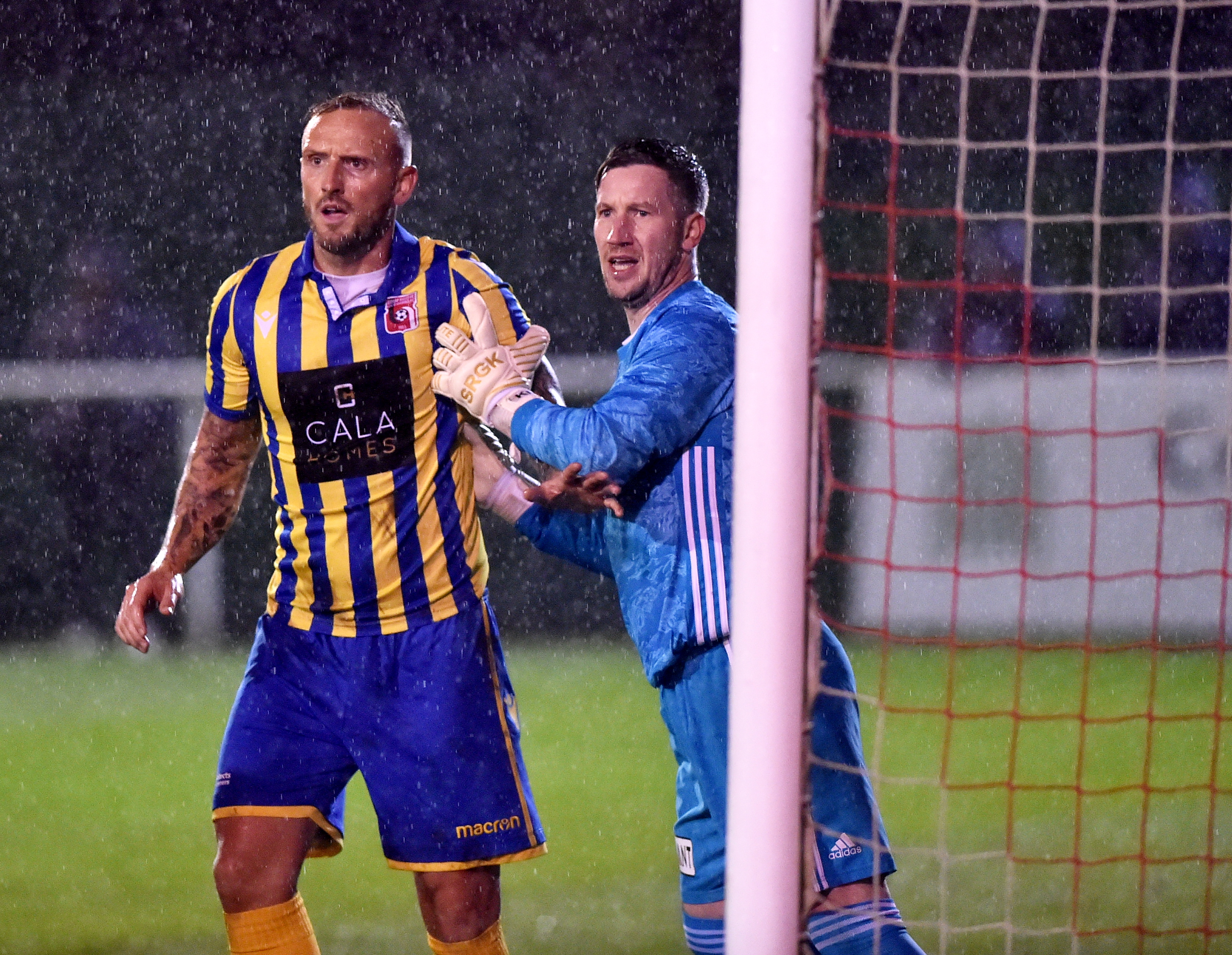 Jonny Smith jostles with Formartine keeper Kevin Main
Picture by Scott Baxter