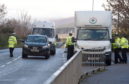 Police carried out roadchecks in Alness as part of their search for Calum Mackenzie. Pictures by Sandy McCook