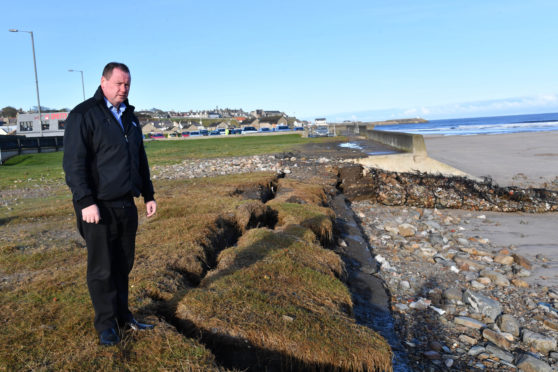 BANFF BUSINESSMAN DES CHEYNE IS CONCERNED WITH THE SPEED OF EROSION AT BANFF BEACH.