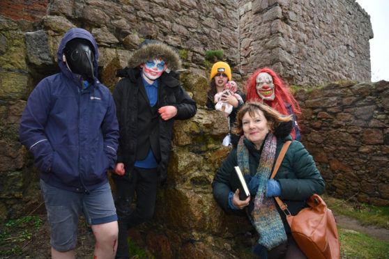 Author Alex Nye with Slains Primary pupils, Fraser Leuchars, Stanley Grasham, Neave Kinghorn and Martha Crockett hoping to get some storytelling inspiration at Slains Castle