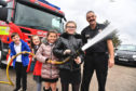 St Fergus Primary pupils (L-R) Clayton Smith, Georgie Robertson, Mylee Hastie and Bethany Duthie get hands on with a fire hose under the watchful eye of Peterhead firefighter Trevor Ashwell
