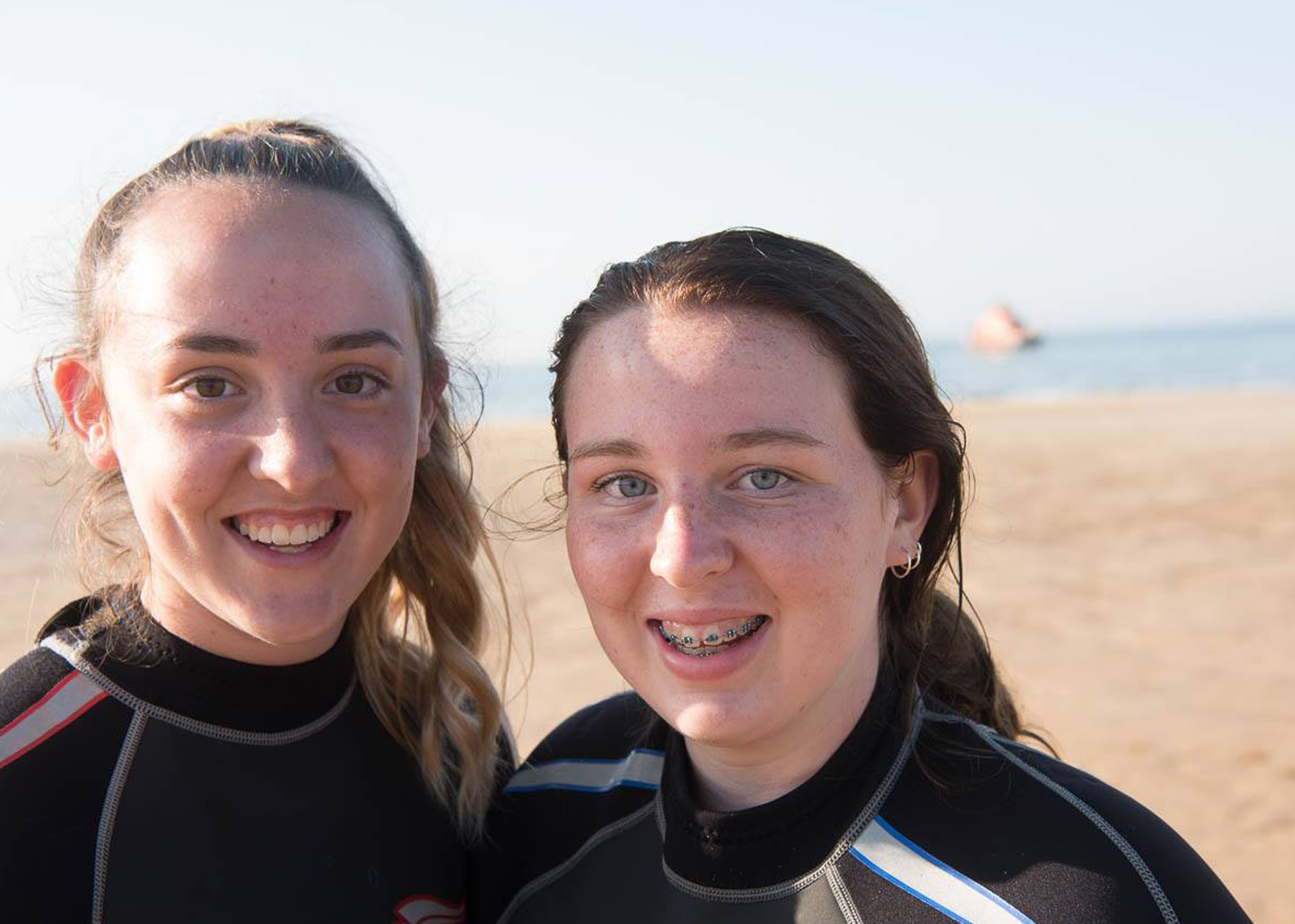Isla Noble (left) and Eilidh (right) were praised by emergency services after using a lilo to rescue a man and child in the water.