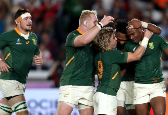 South Africa's Makazole Mapimpi (right) celebrates with team-mates after scoring his side's first try of the game during the 2019 Rugby World Cup final.