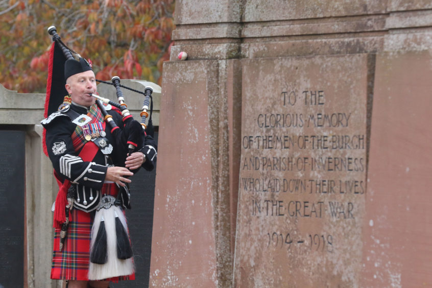 Pipe Major Gordon Straube of the Royal British Legion pipe band.