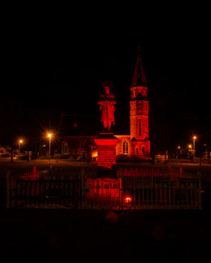 Rhynie Church and Memorial glowing red