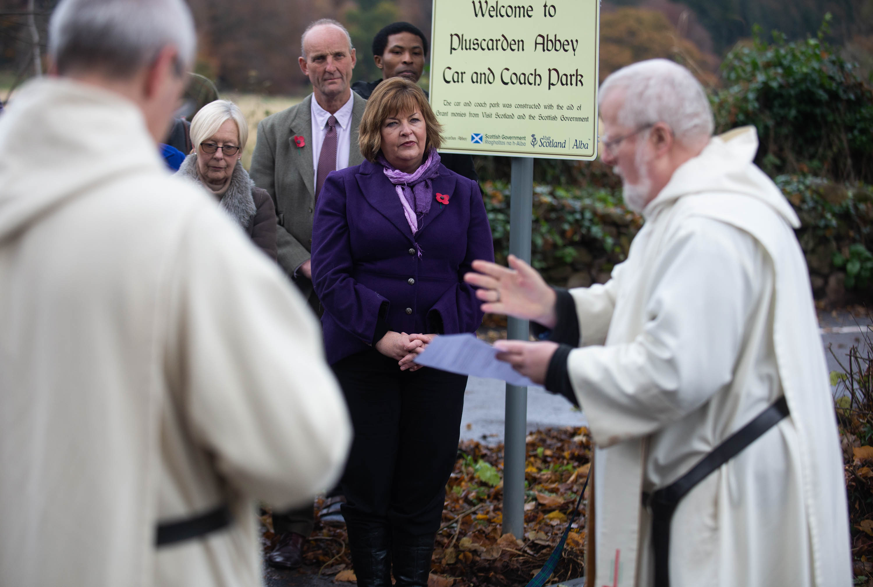 The Pluscarden Abbey car park was blessed with prayer and holy water during a visit by Scottish Government minister Fiona Hyslop.