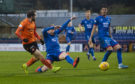 Dundee Utd's Paul McMullan's shot is deflected into the goal off Inverness' Shaun Rooney to make it 1-0.