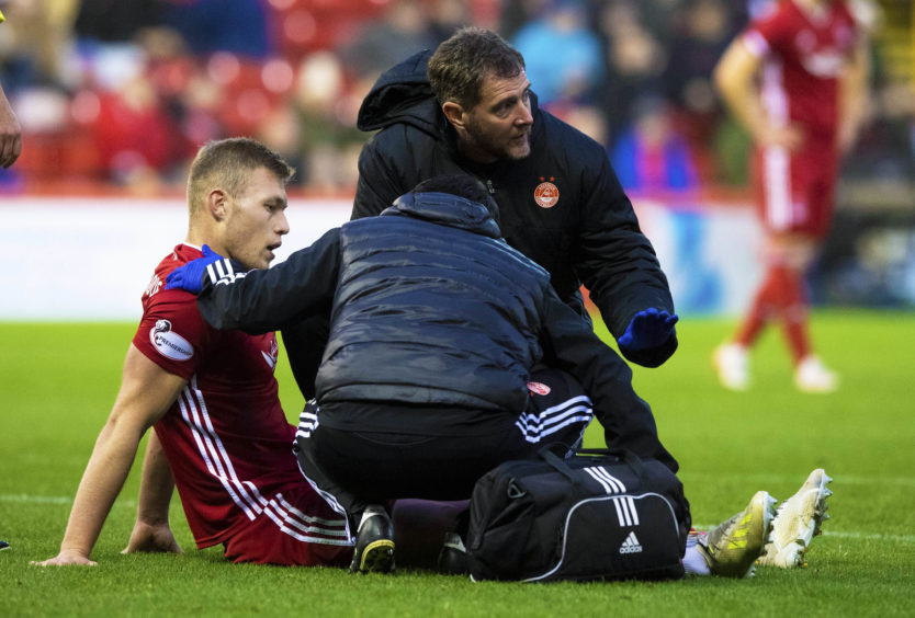 Aberdeen's Sam Cosgrove goes down with an injury and is forced off during the Ladbrokes Premiership match between Aberdeen and Kilmarnock