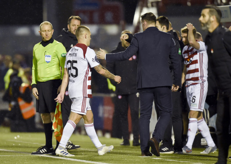 Hamilton's Scott Martin walks off the pitch after being shown a red card during the Ladbrokes Premiership match between Hamilton and Ross County