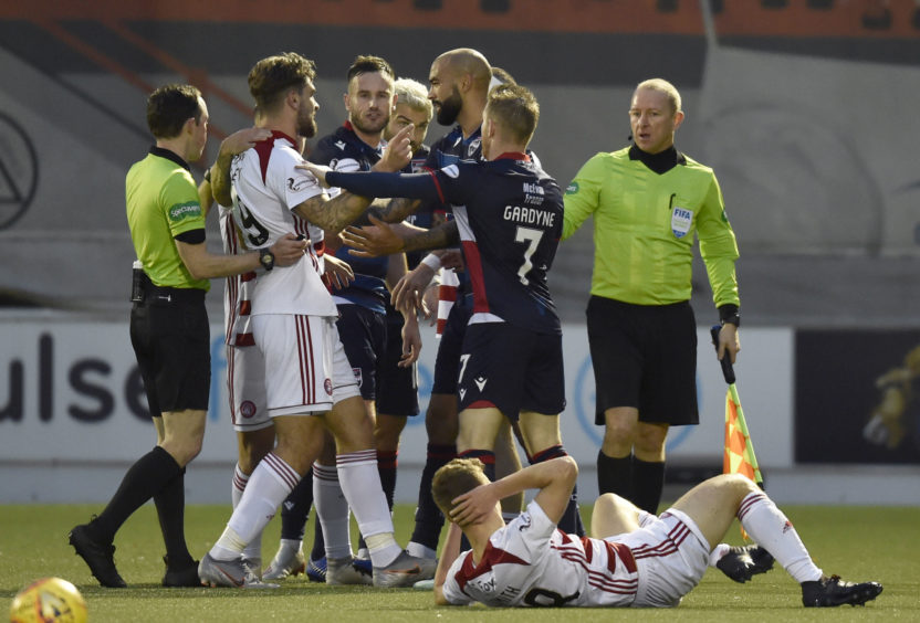 A scuffle takes place takes place between the two sides after a challenge on Lewis Smith by Richard Foster during the Ladbrokes Premiership match between Hamilton and Ross County