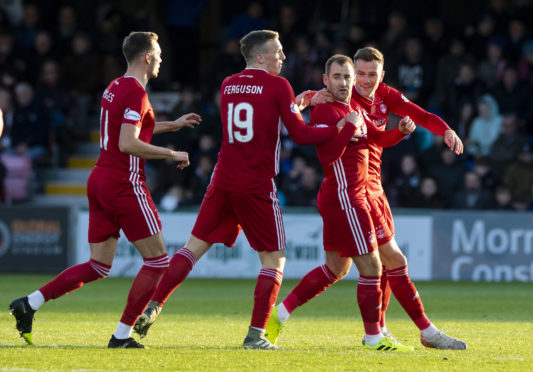 Aberdeen's Niall McGinn celebrates scoring to make it 1-1 with team-mates during the Ladbrokes Premiership match between Ross County and Aberdeen at the Global Energy Stadium.