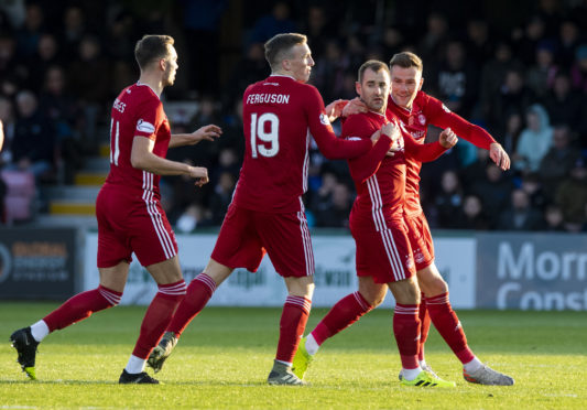 Aberdeen's Niall McGinn celebrates scoring to make it 1-1 at Ross County