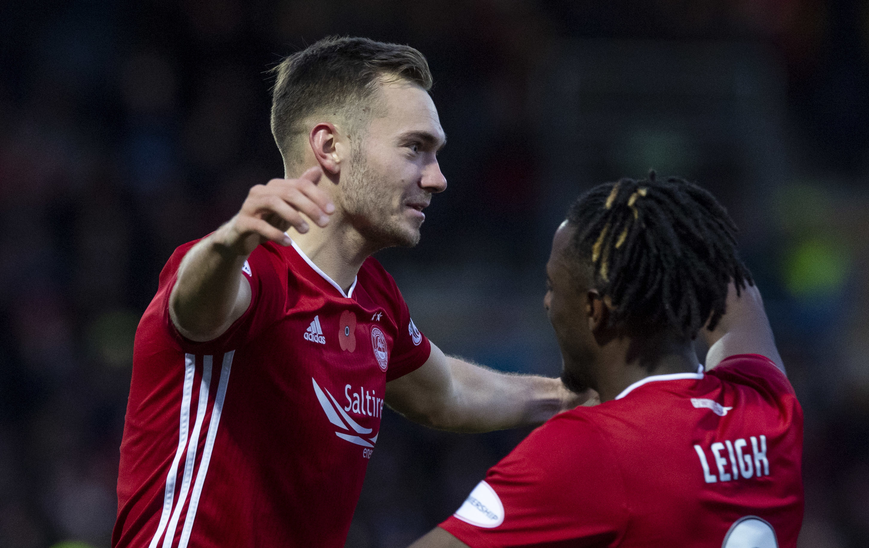 Aberdeen's Ryan Hedges (L) celebrates his goal to make it 2-1 with team mate Greg Leigh during the Ladbrokes Premiership match between Ross County and Aberdeen