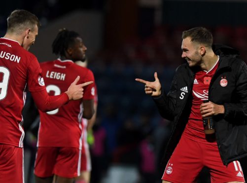 Aberdeen's Lewis Ferguson celebrates at full time with team mate Ryan Hedges (R) during the Ladbrokes Premiership match between Ross County and Aberdeen